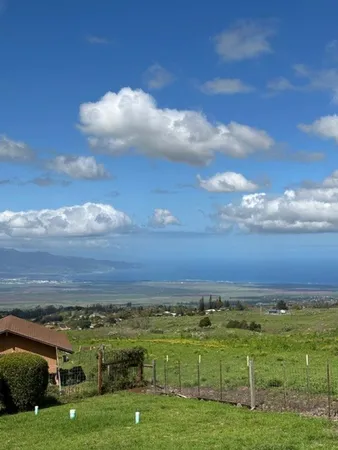 a view of an ocean and a building