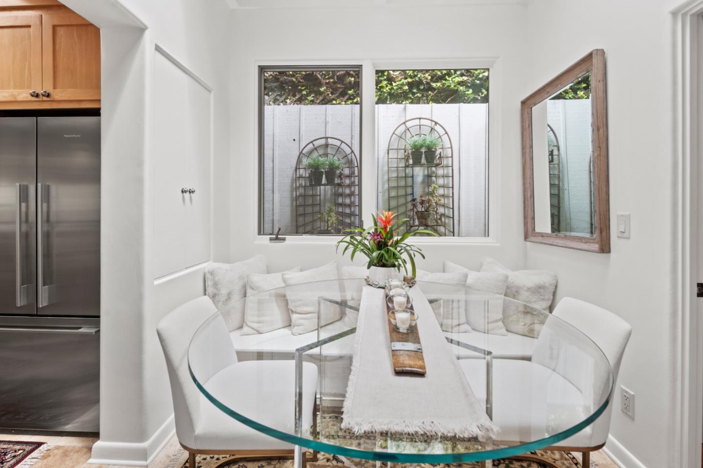 0 Lobos Street Carmel, CA 93923 - Photo 23 of 54 a dining room with furniture and a floor to ceiling window