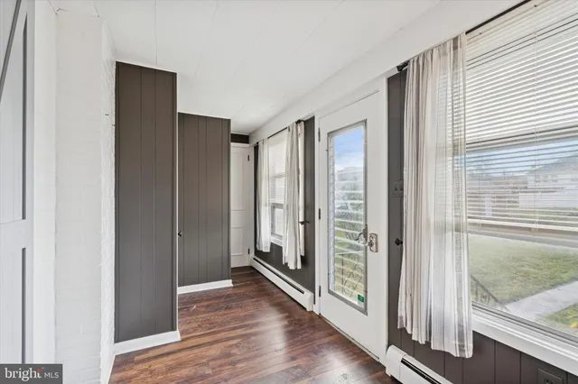 a view of entryway with wooden floor