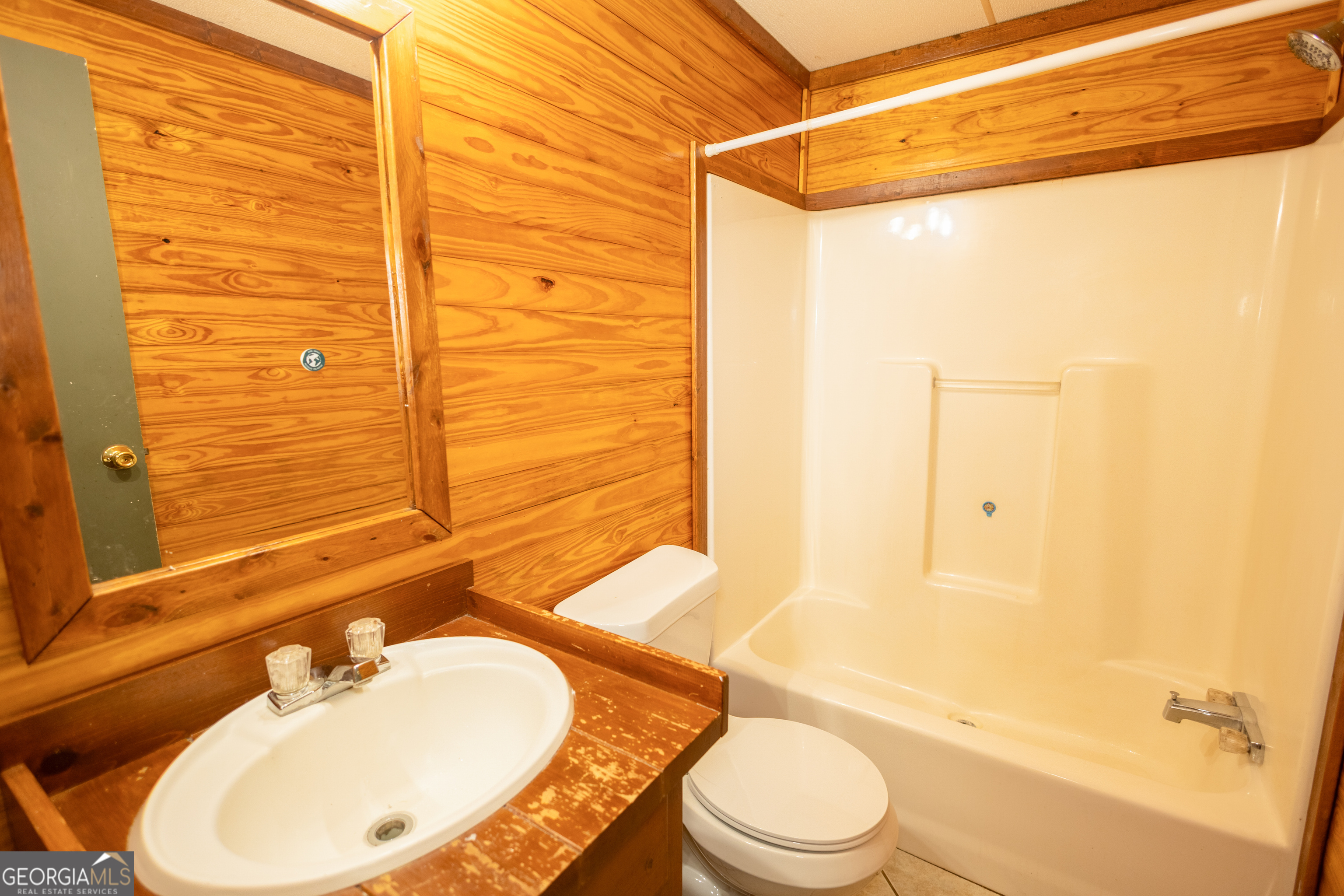 35 Brooks Street Canon, GA 30520 - Photo 16 of 25 a bathroom with a sink toilet and shower