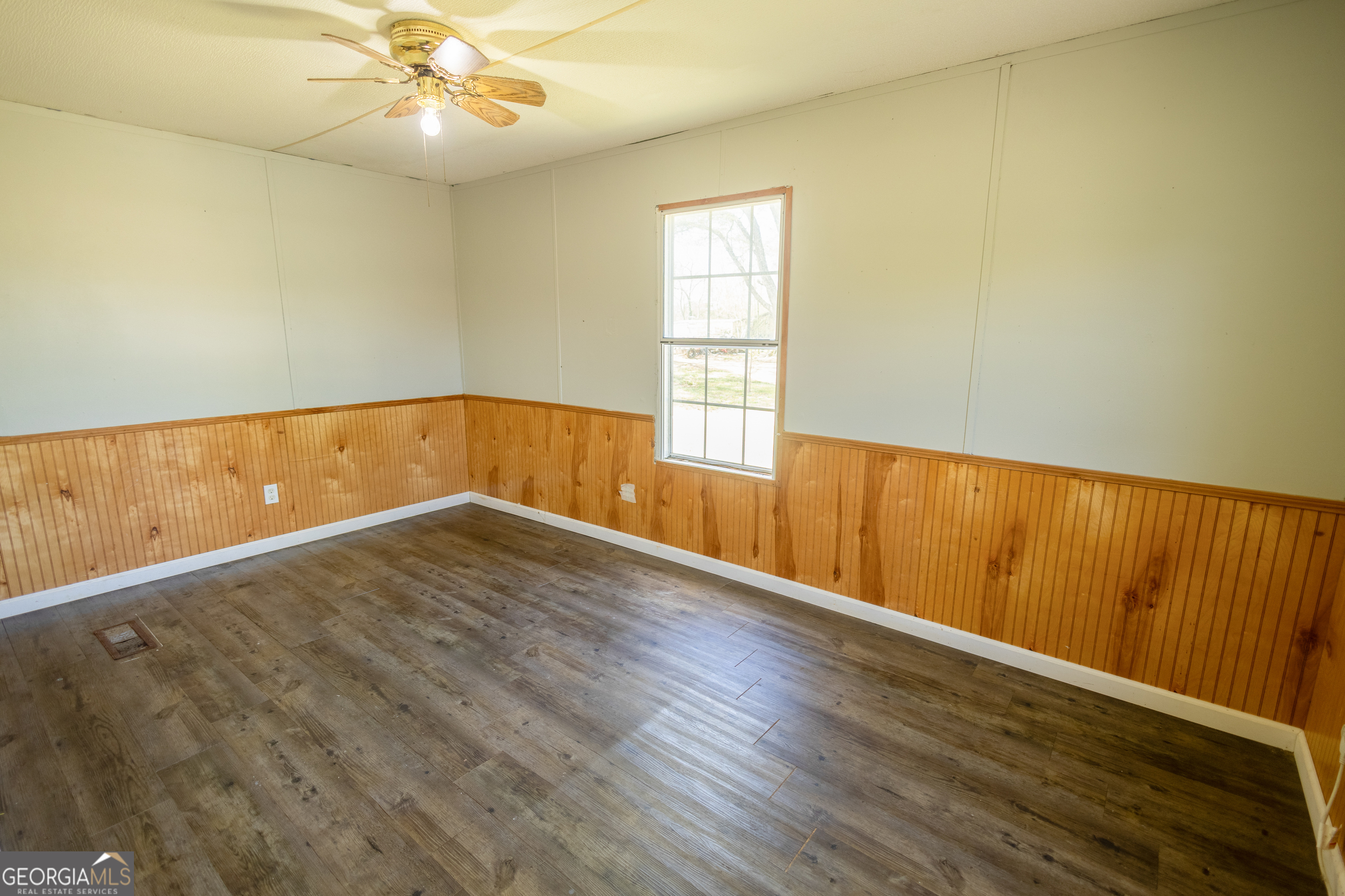 35 Brooks Street Canon, GA 30520 - Photo 18 of 25 wooden floor in an empty room with a window