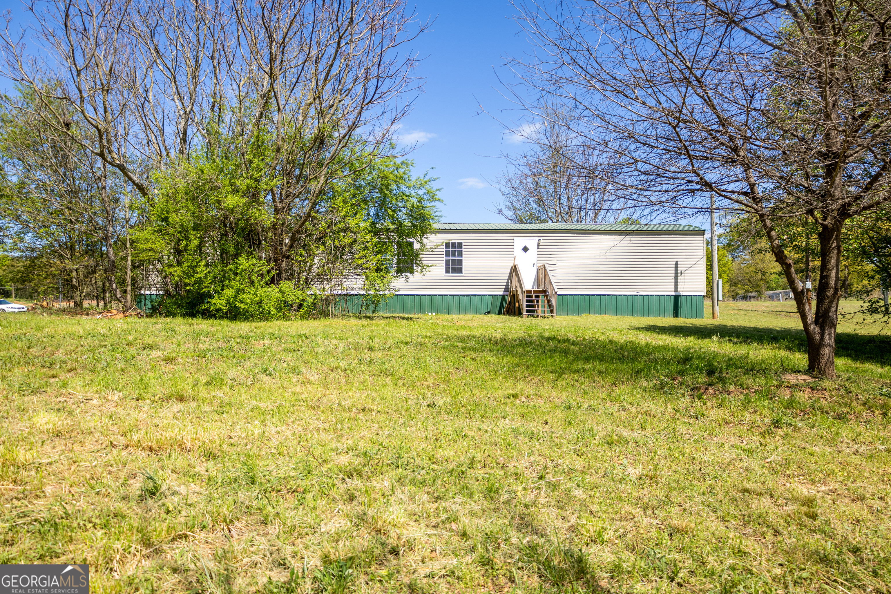 35 Brooks Street Canon, GA 30520 - Photo 20 of 25 a view of a yard with a house in the background