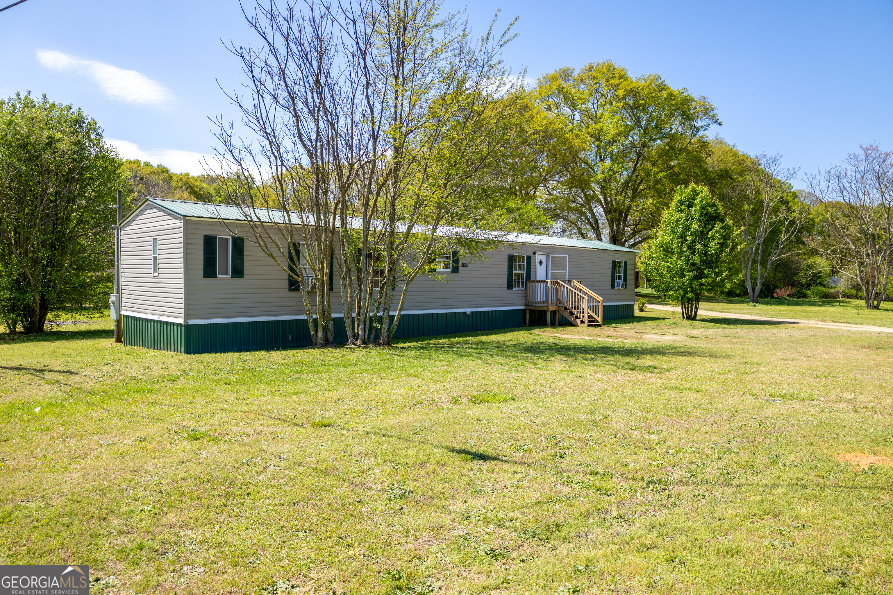 35 Brooks Street Canon, GA 30520 - Photo 2 of 25 a front view of house with yard and trees