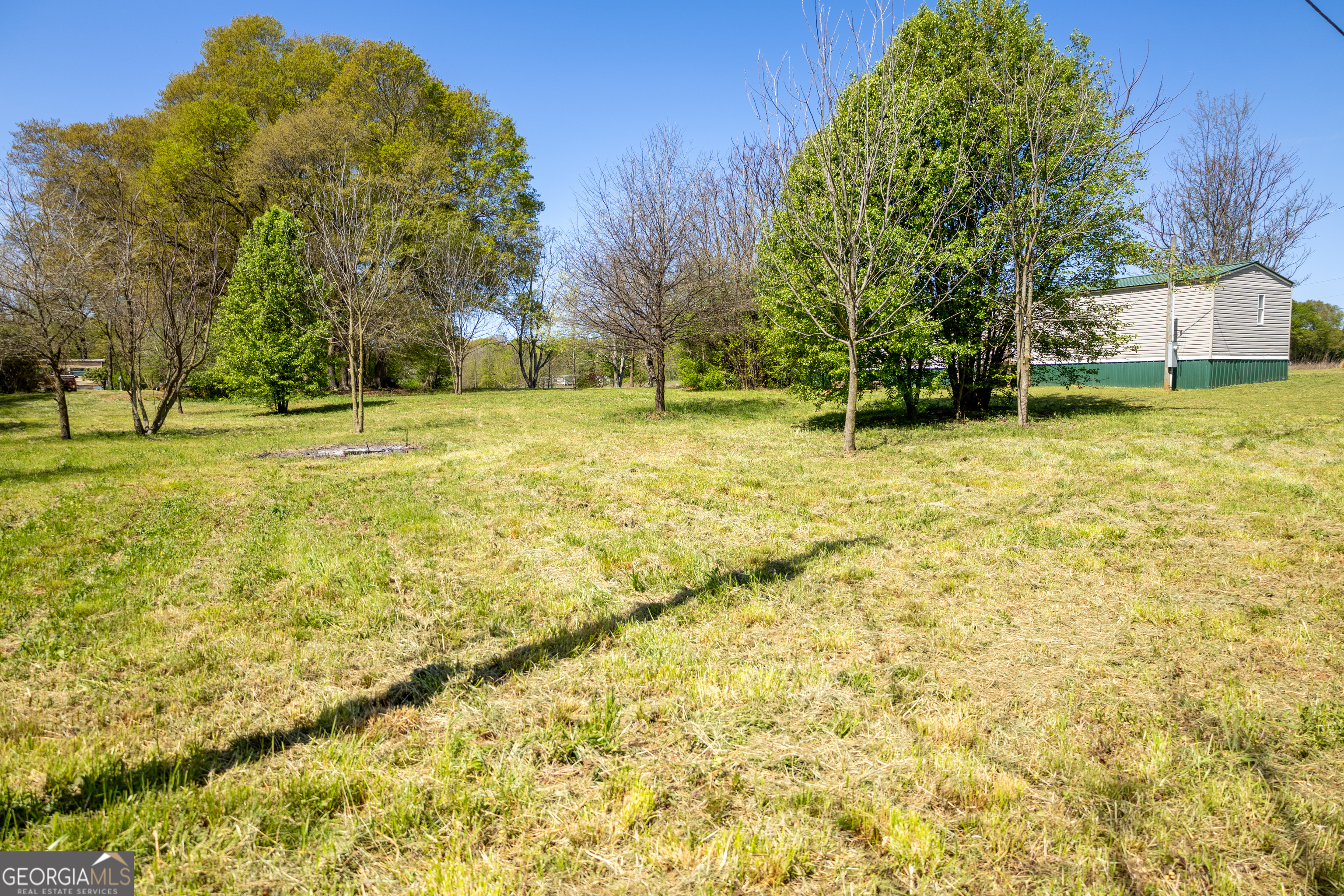 35 Brooks Street Canon, GA 30520 - Photo 22 of 25 a swimming pool with trees in the background