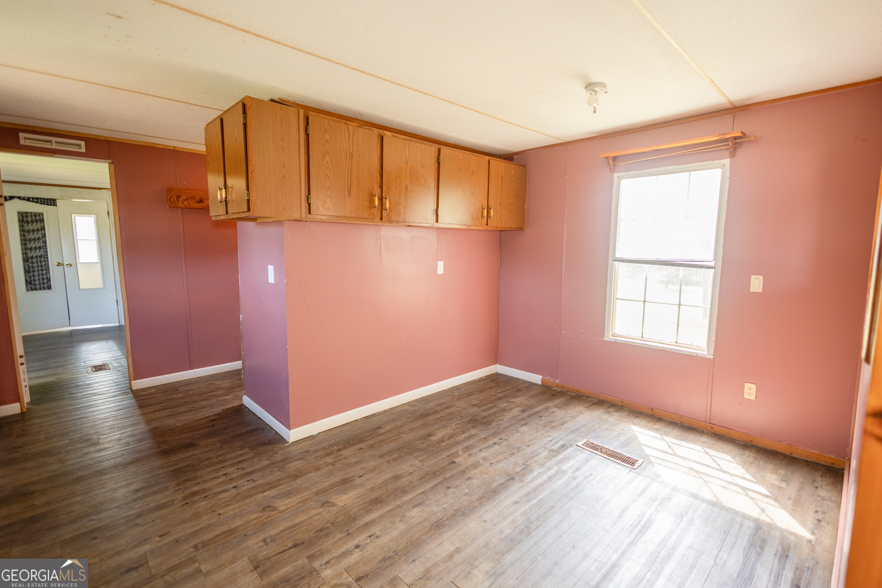 35 Brooks Street Canon, GA 30520 - Photo 5 of 25 a view of a livingroom with wooden floor and a window