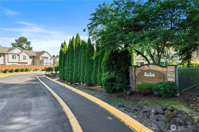 a view of a street with a building in the background