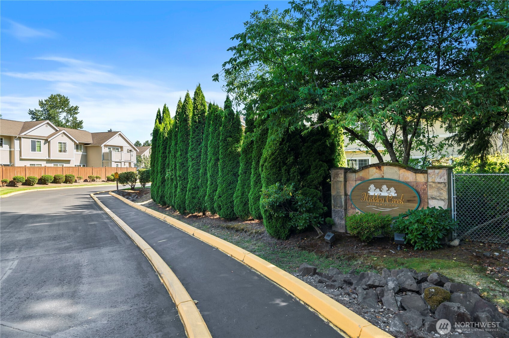1522 196th Street Southeast, Unit C103 Bothell, WA 98012 - Photo 19 of 24 a view of a street with a building in the background