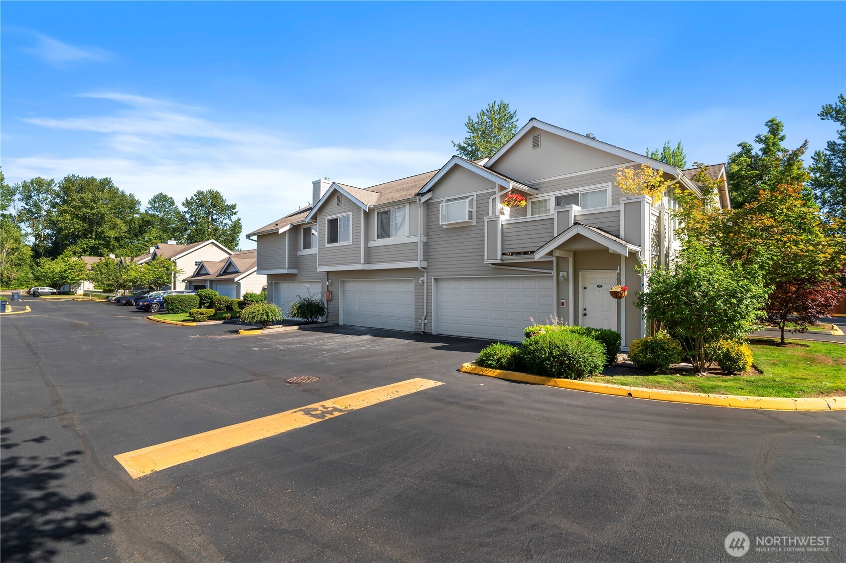 1522 196th Street Southeast, Unit C103 Bothell, WA 98012 - Photo 20 of 24 a front view of a house with a yard and garage