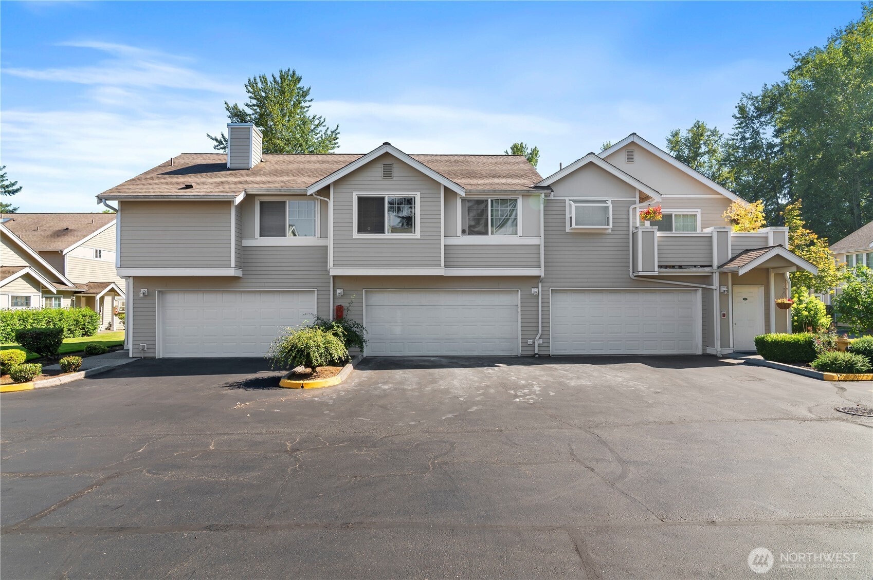 1522 196th Street Southeast, Unit C103 Bothell, WA 98012 - Photo 23 of 24 a front view of a house with a yard and garage