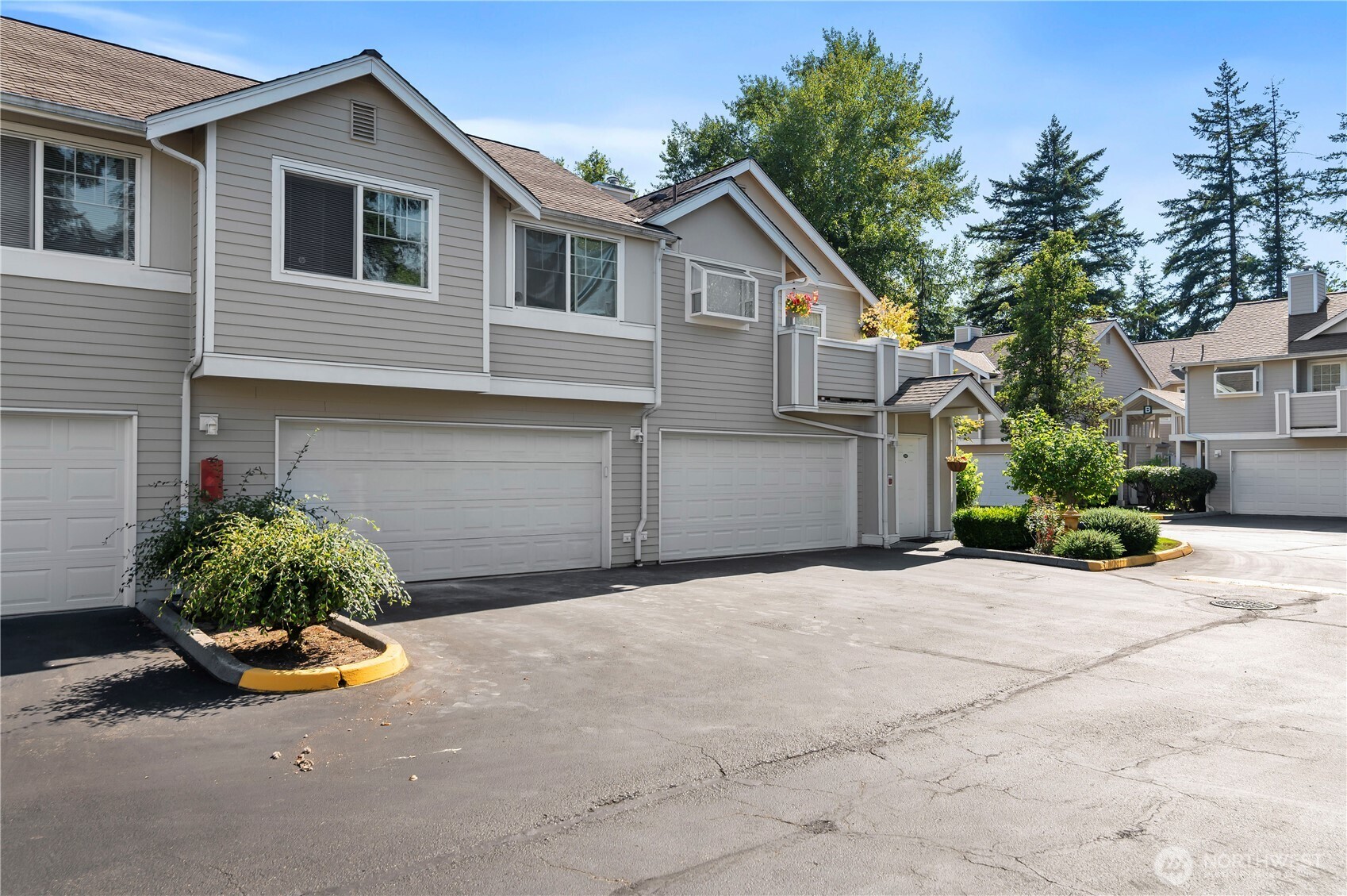 1522 196th Street Southeast, Unit C103 Bothell, WA 98012 - Photo 24 of 24 a front view of a house with a yard and garage