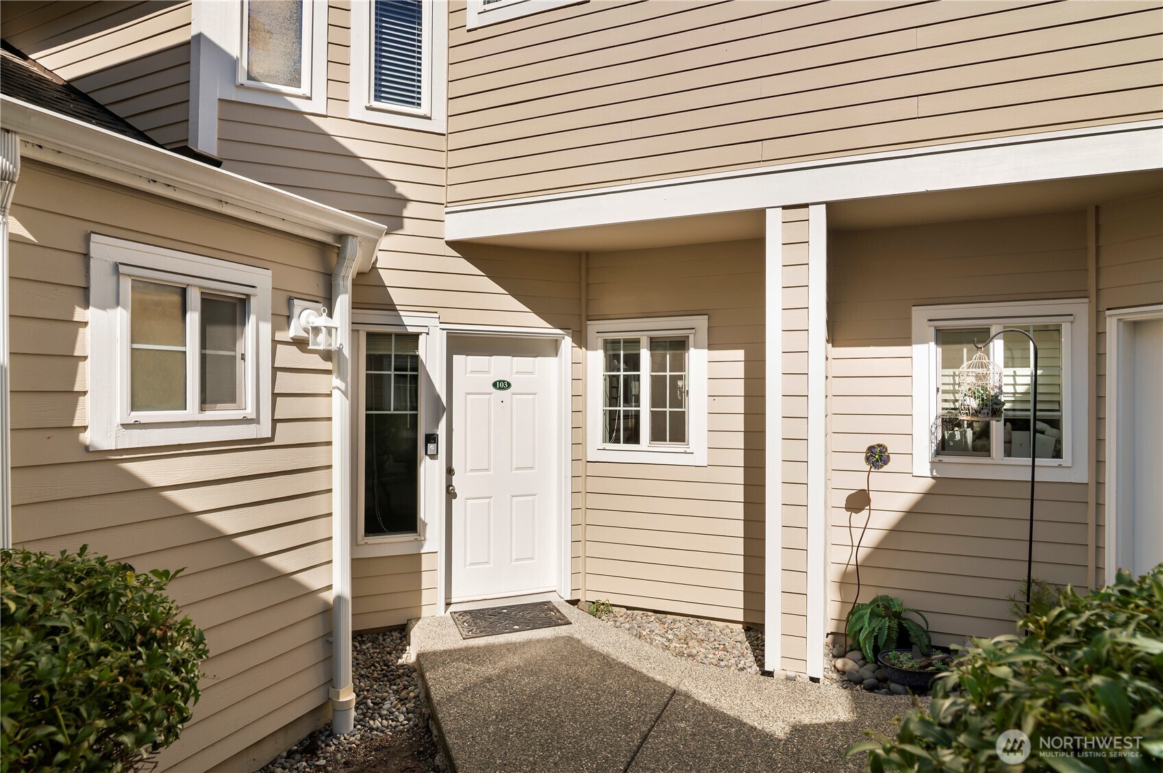 1522 196th Street Southeast, Unit C103 Bothell, WA 98012 - Photo 4 of 24 a view of a house with a white door