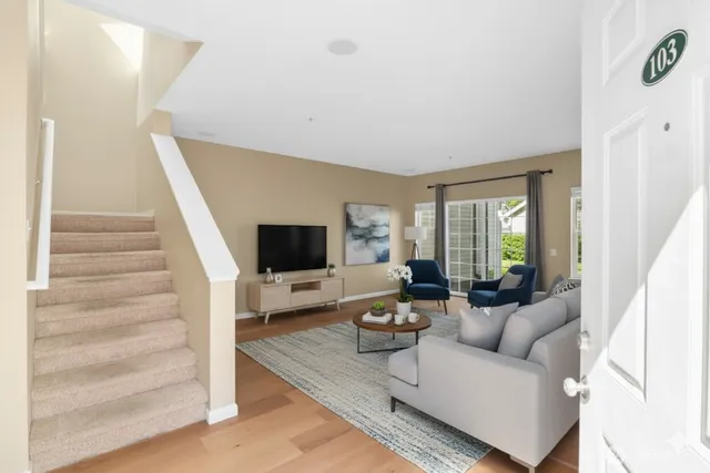 a living room with furniture and a flat screen tv