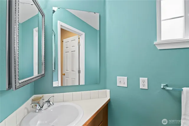 a bathroom with a sink and a mirror