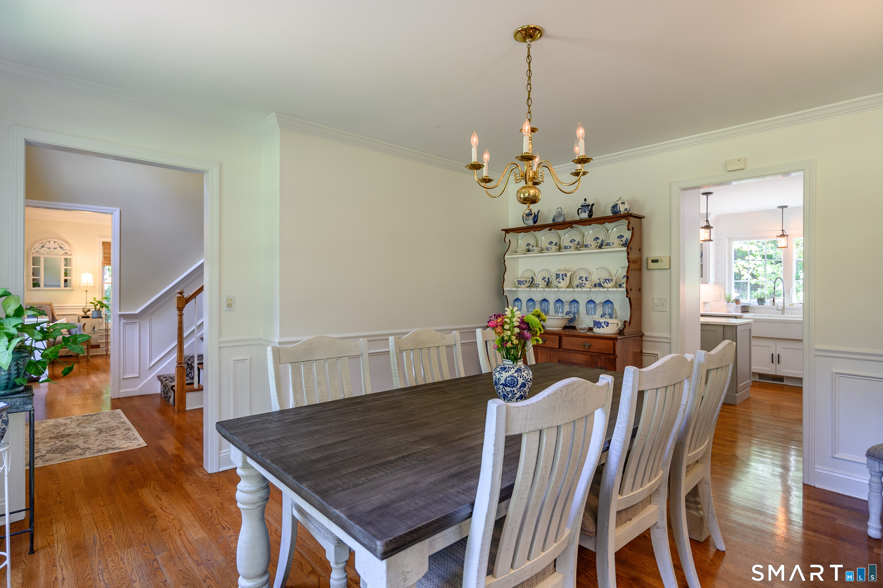 21 Phyllis Lane Newtown, CT 06470 - Photo 15 of 40 Dining room with hardwood floors and classic chandelier.