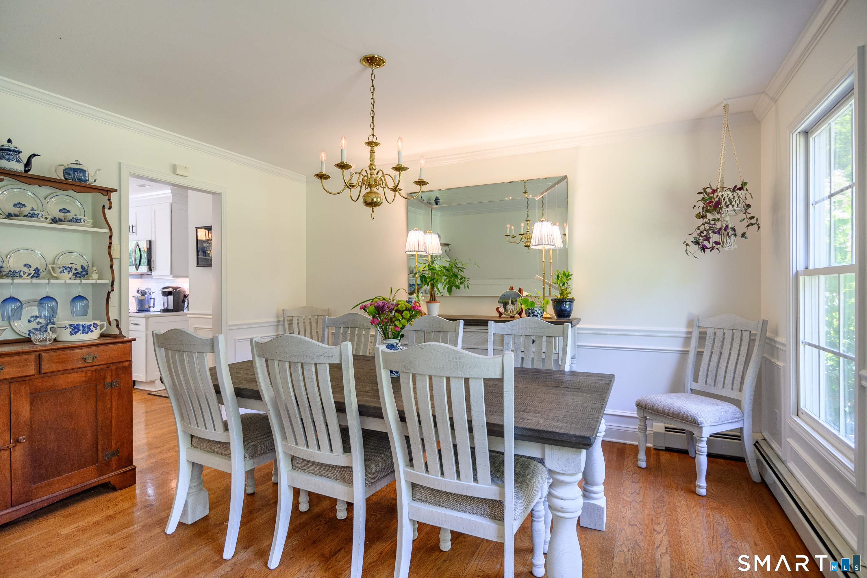 21 Phyllis Lane Newtown, CT 06470 - Photo 16 of 40 Elegant dining room with large windows and space for gatherings.