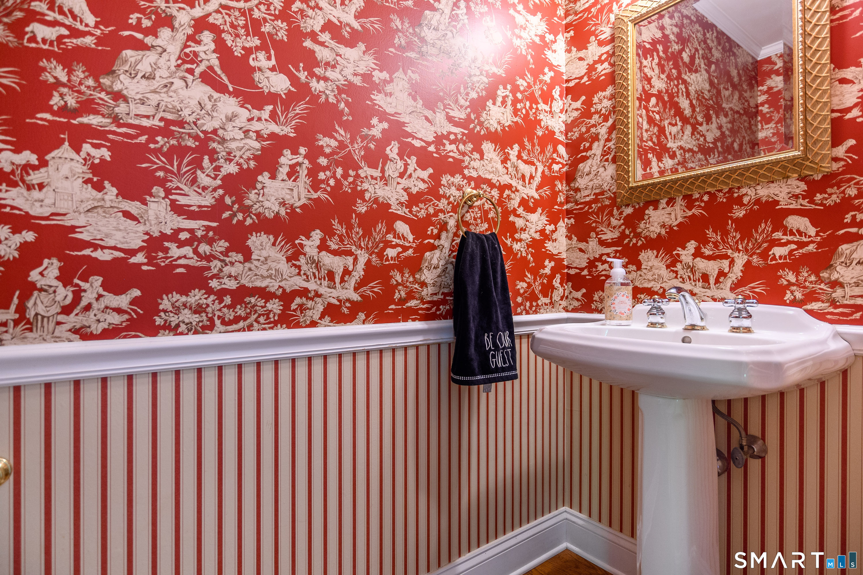 21 Phyllis Lane Newtown, CT 06470 - Photo 17 of 40 Stylish powder room with bold designer wallpaper and pedestal sink.