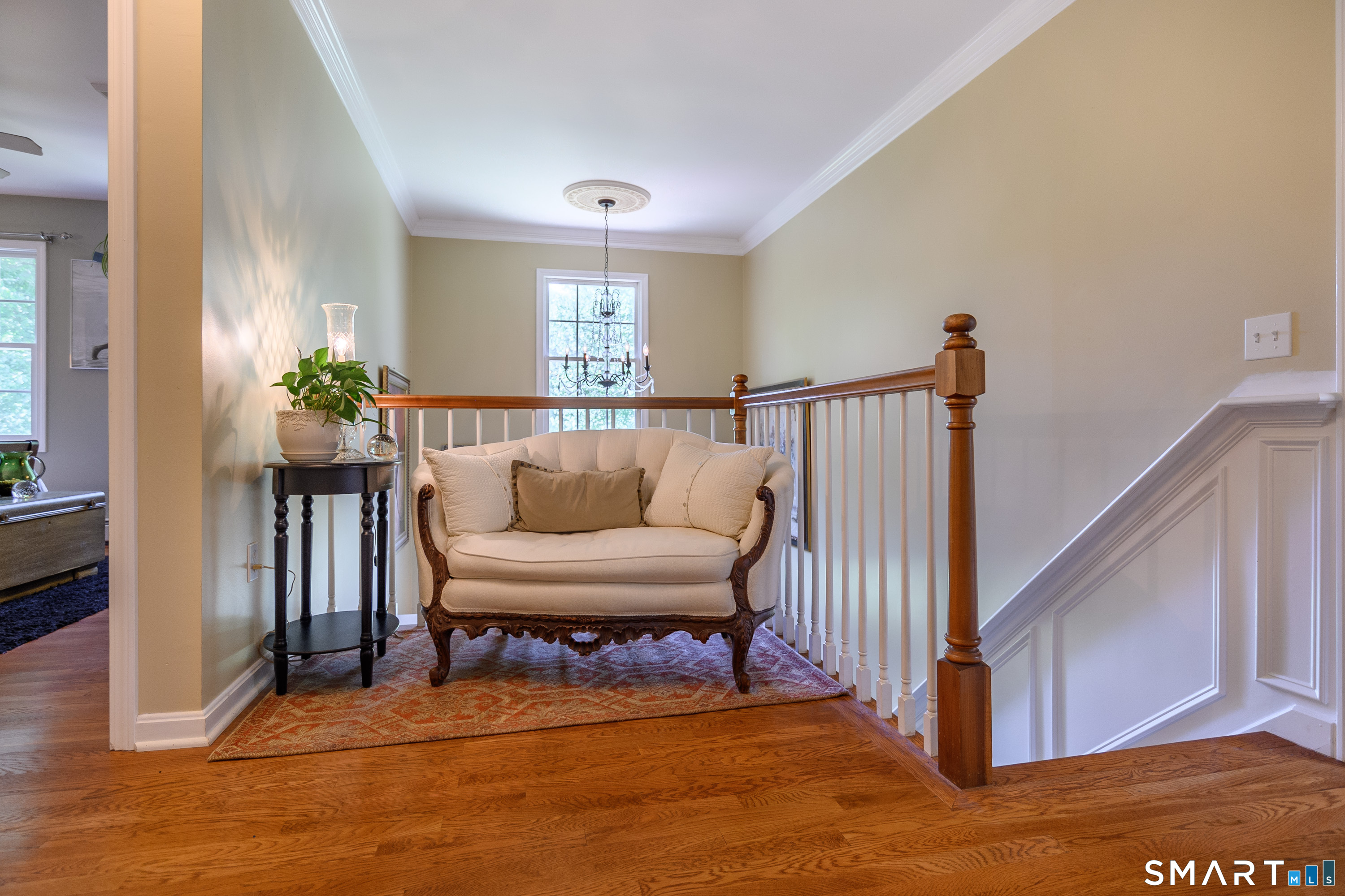 21 Phyllis Lane Newtown, CT 06470 - Photo 18 of 40 Second-floor landing with hardwood floors and cozy sitting area.