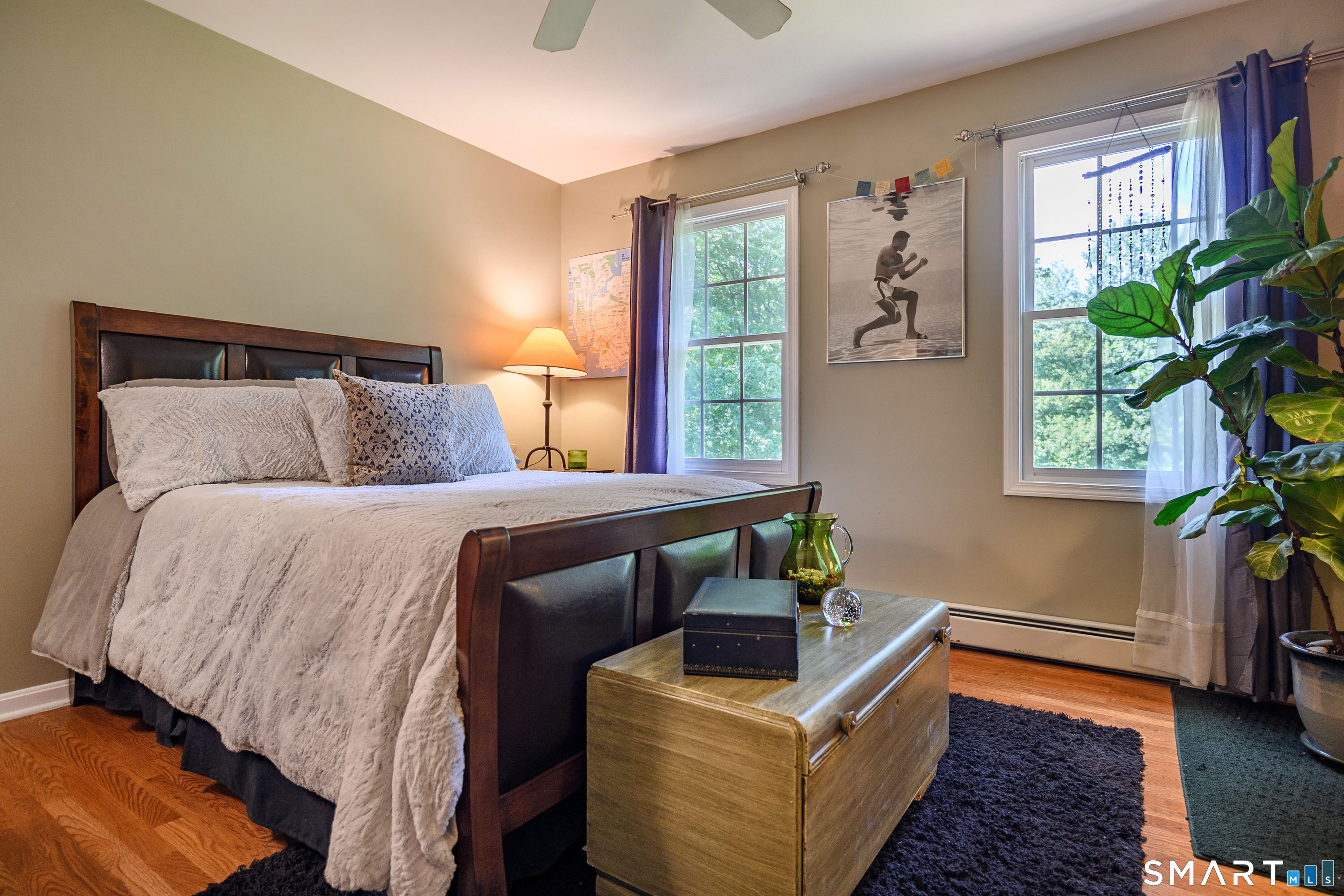 21 Phyllis Lane Newtown, CT 06470 - Photo 22 of 40 Comfortable bedroom with hardwood floors, large windows, and ceiling fan