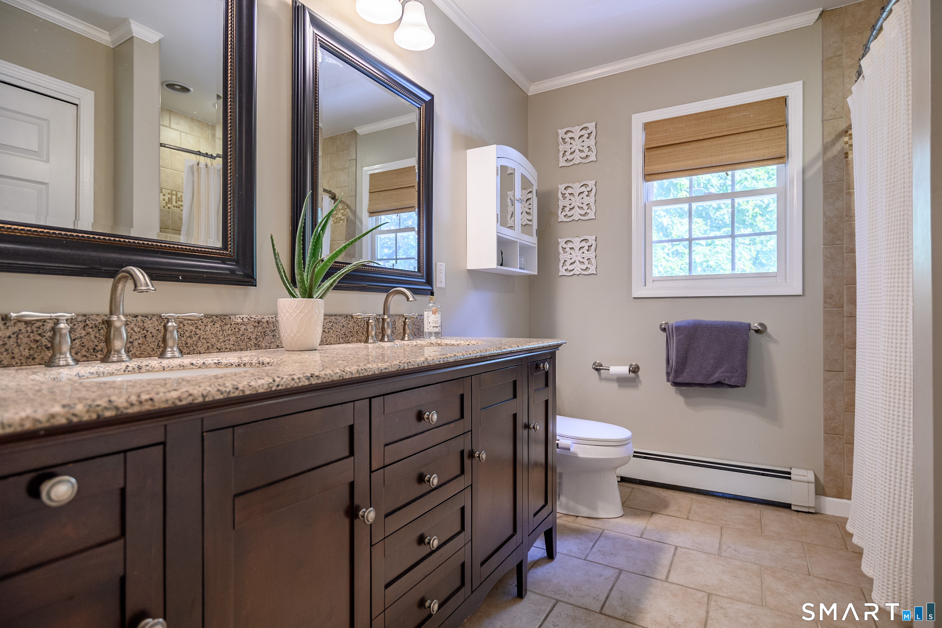 21 Phyllis Lane Newtown, CT 06470 - Photo 26 of 40 Full bath with granite vanity, framed mirror, and tiled tub/shower.