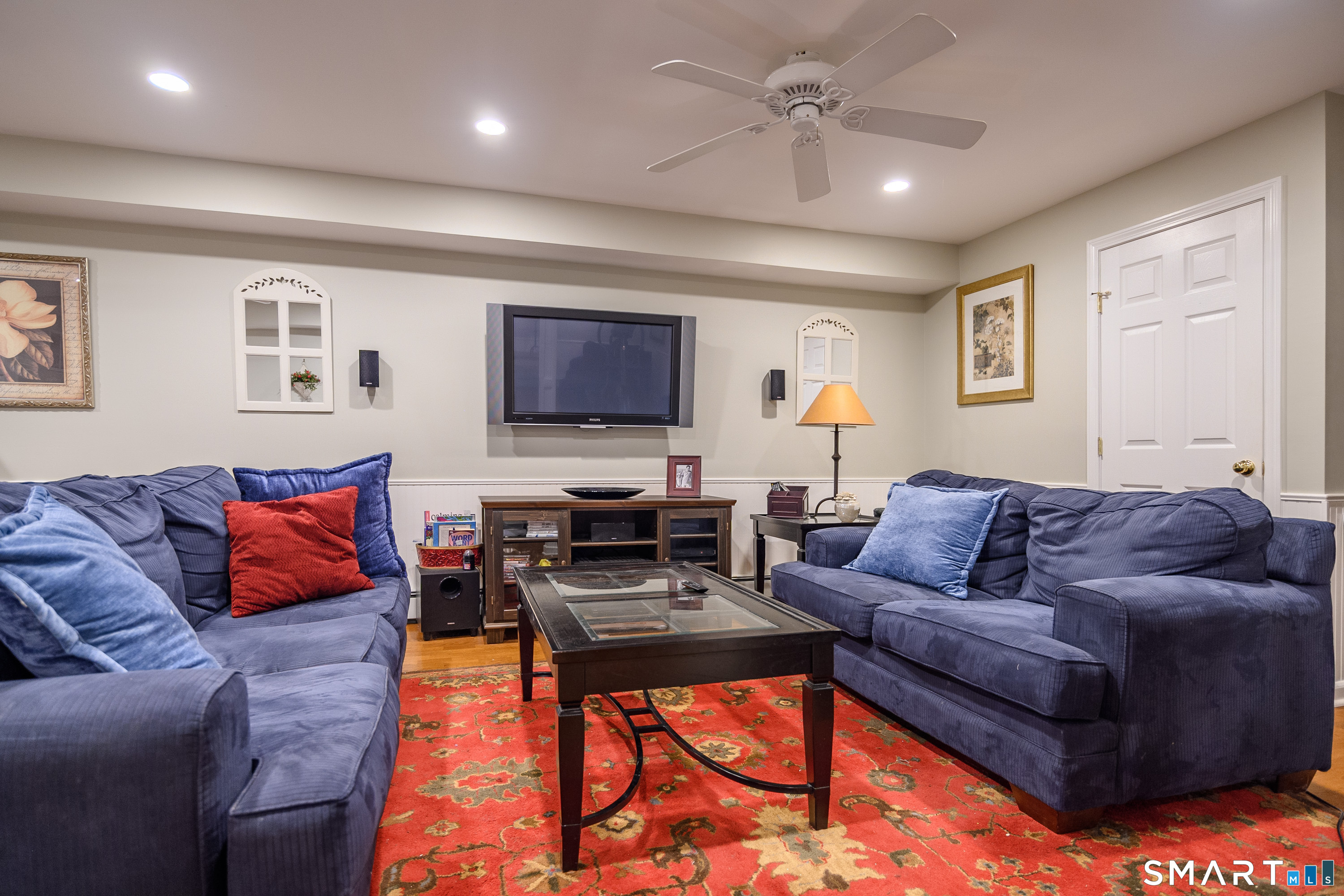 21 Phyllis Lane Newtown, CT 06470 - Photo 28 of 40 Lower-level family room with recessed lighting and media area.