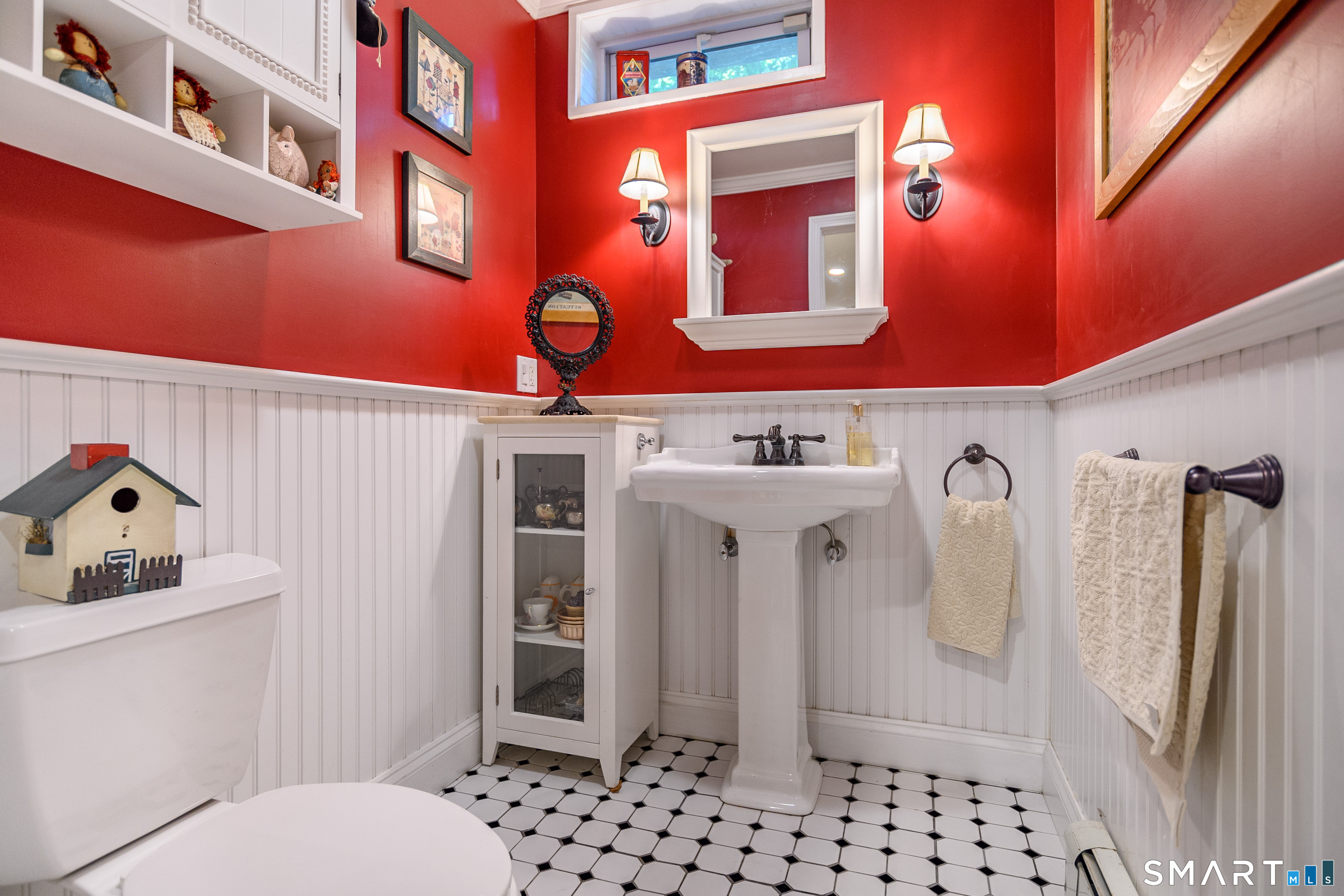 21 Phyllis Lane Newtown, CT 06470 - Photo 30 of 40 Stylish powder room with beadboard trim and pedestal sink.
