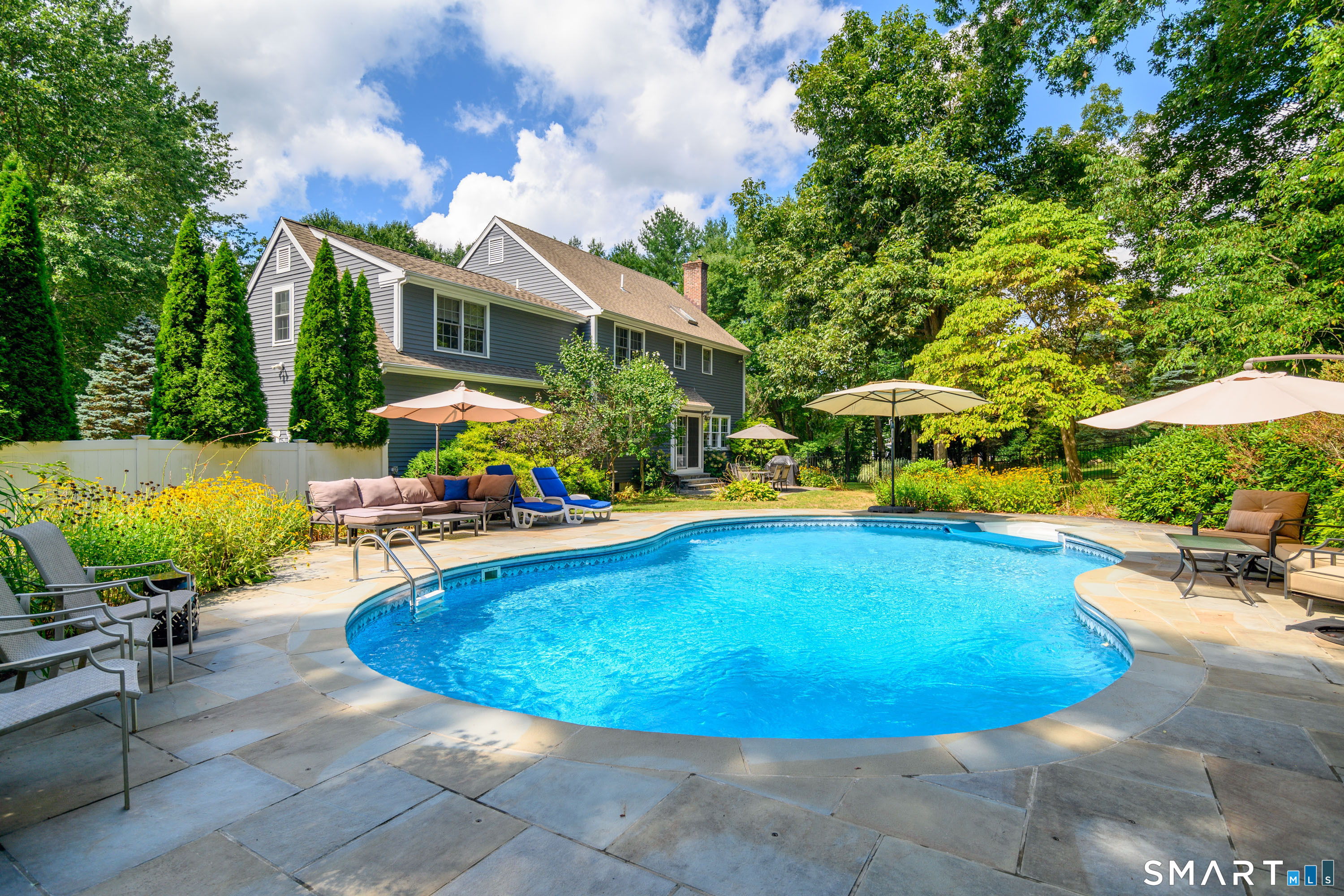 21 Phyllis Lane Newtown, CT 06470 - Photo 33 of 40 Resort-style pool area with area for lounge seating.