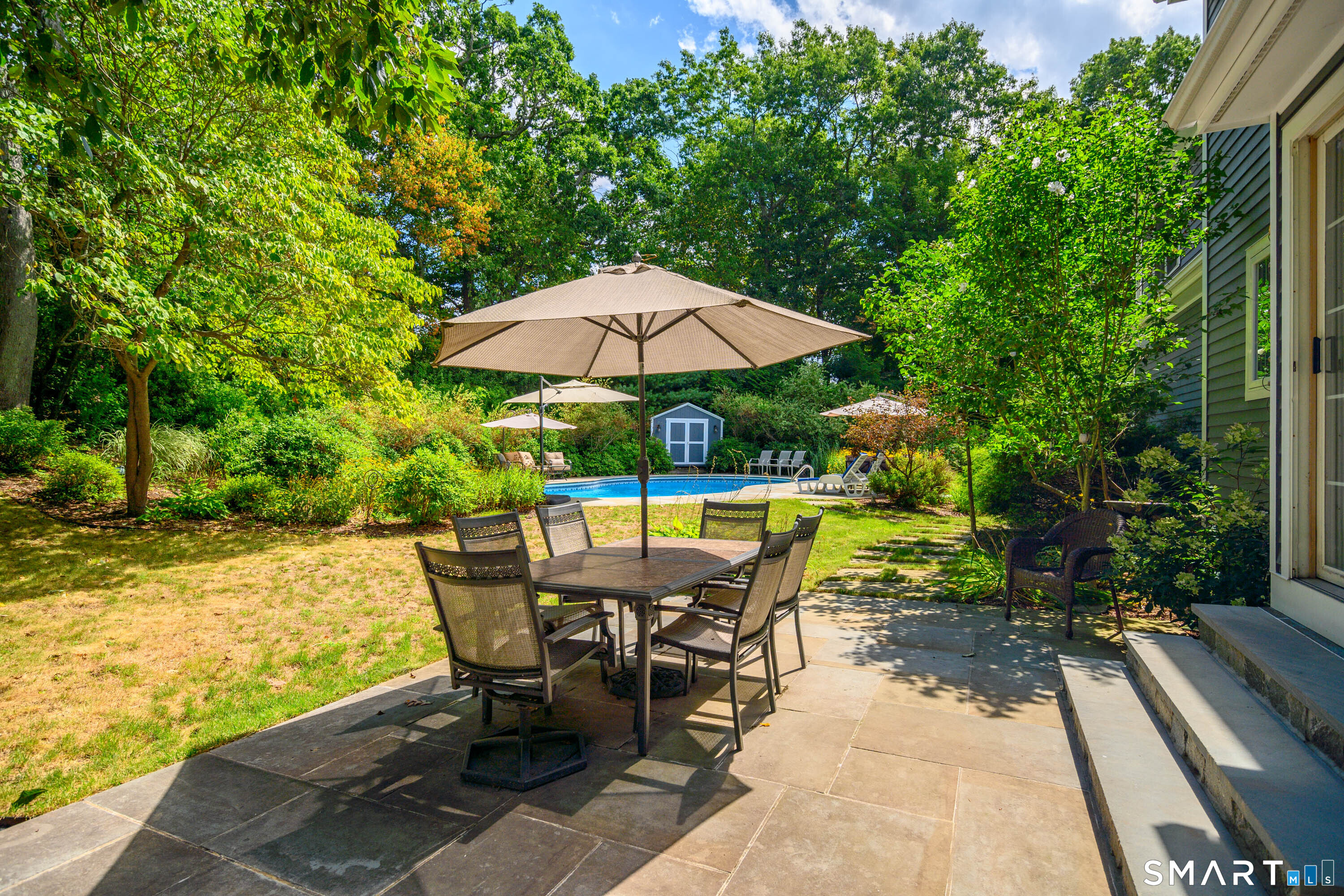 21 Phyllis Lane Newtown, CT 06470 - Photo 34 of 40 Backyard oasis featuring patio dining area and lush landscaped grounds.