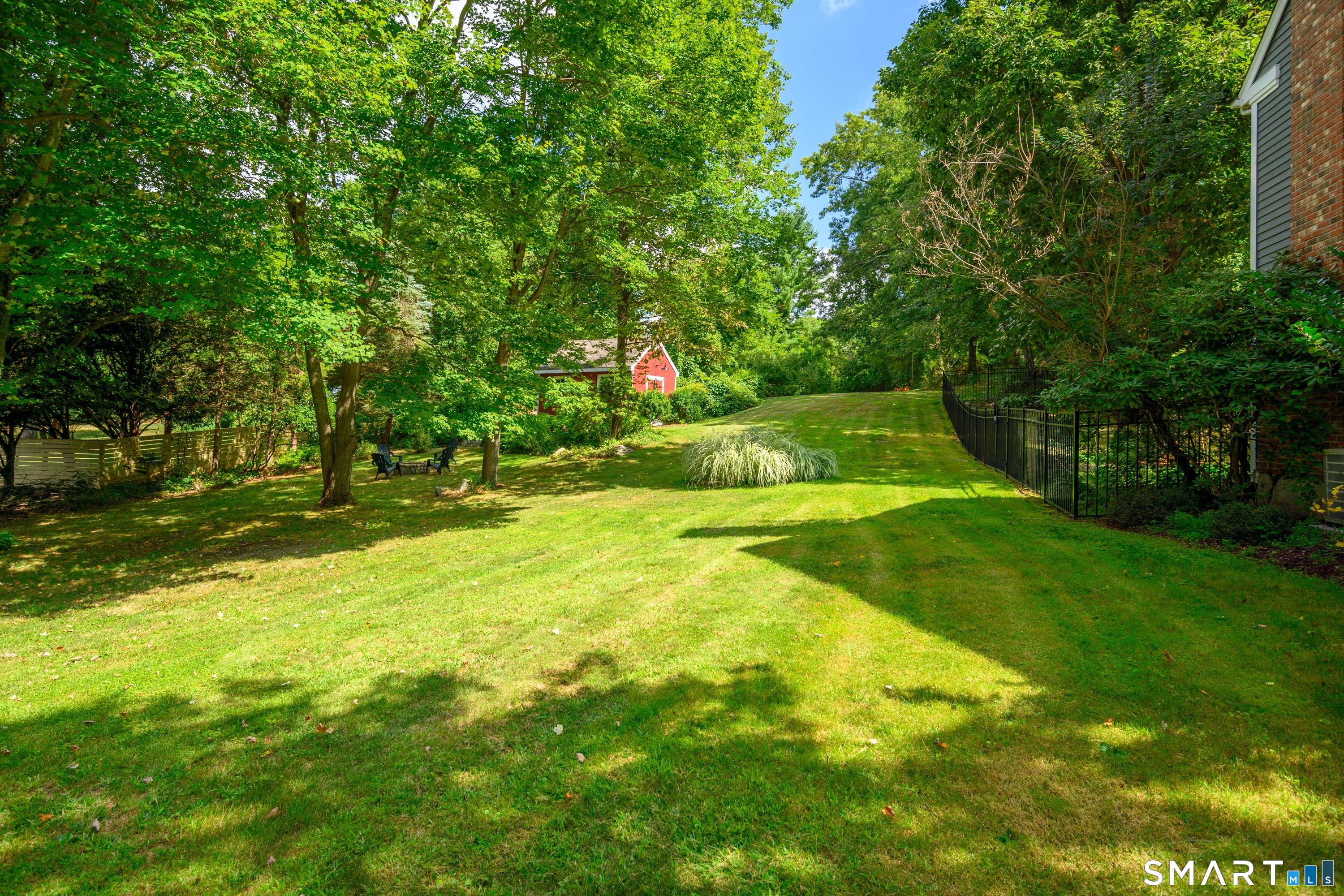 21 Phyllis Lane Newtown, CT 06470 - Photo 36 of 40 Private backyard with expansive lawn and mature trees.