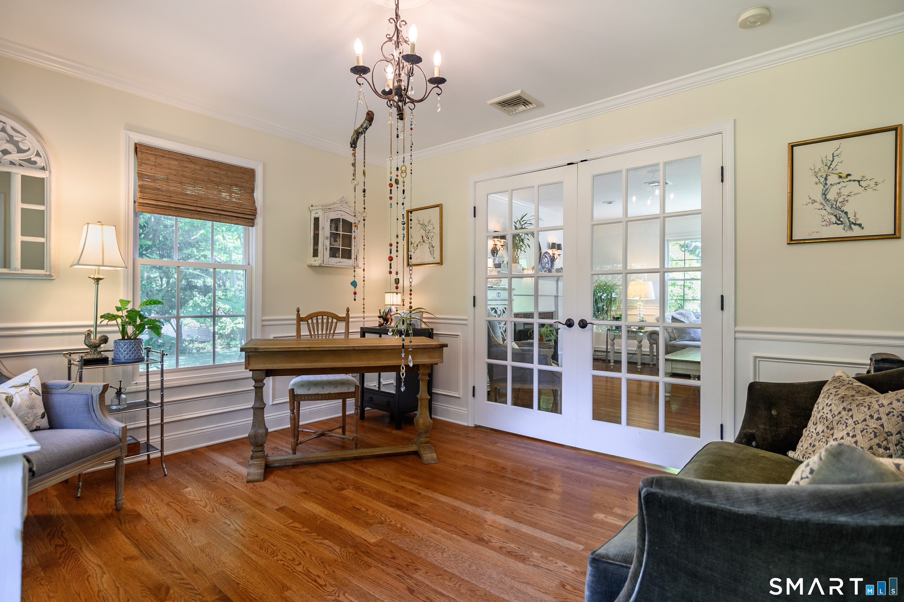 21 Phyllis Lane Newtown, CT 06470 - Photo 4 of 40 Sun-filled home office with French doors, hardwood floors, and large windows.