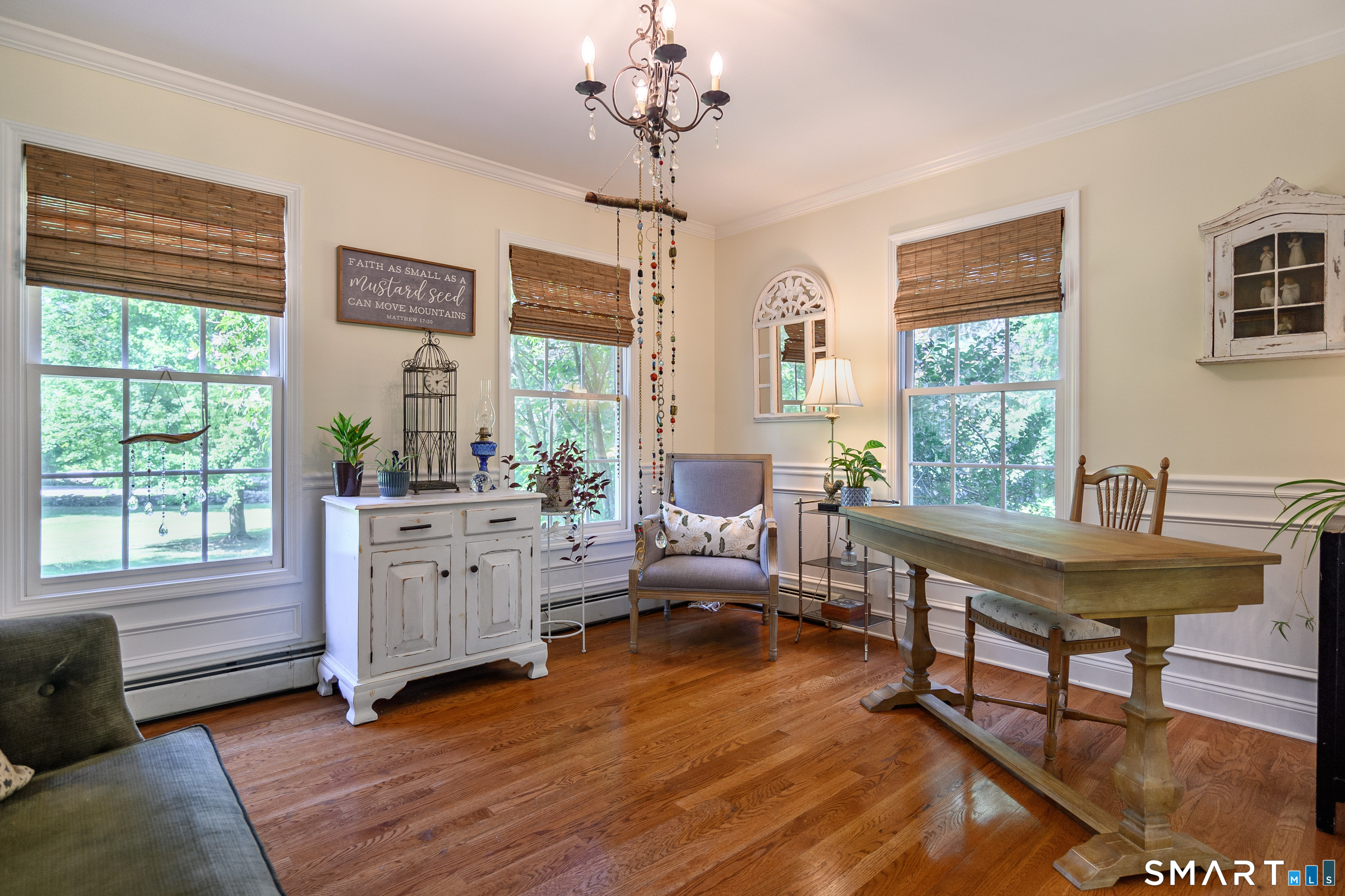 21 Phyllis Lane Newtown, CT 06470 - Photo 5 of 40 Inviting office/sitting room featuring abundant natural light and elegant trim details.