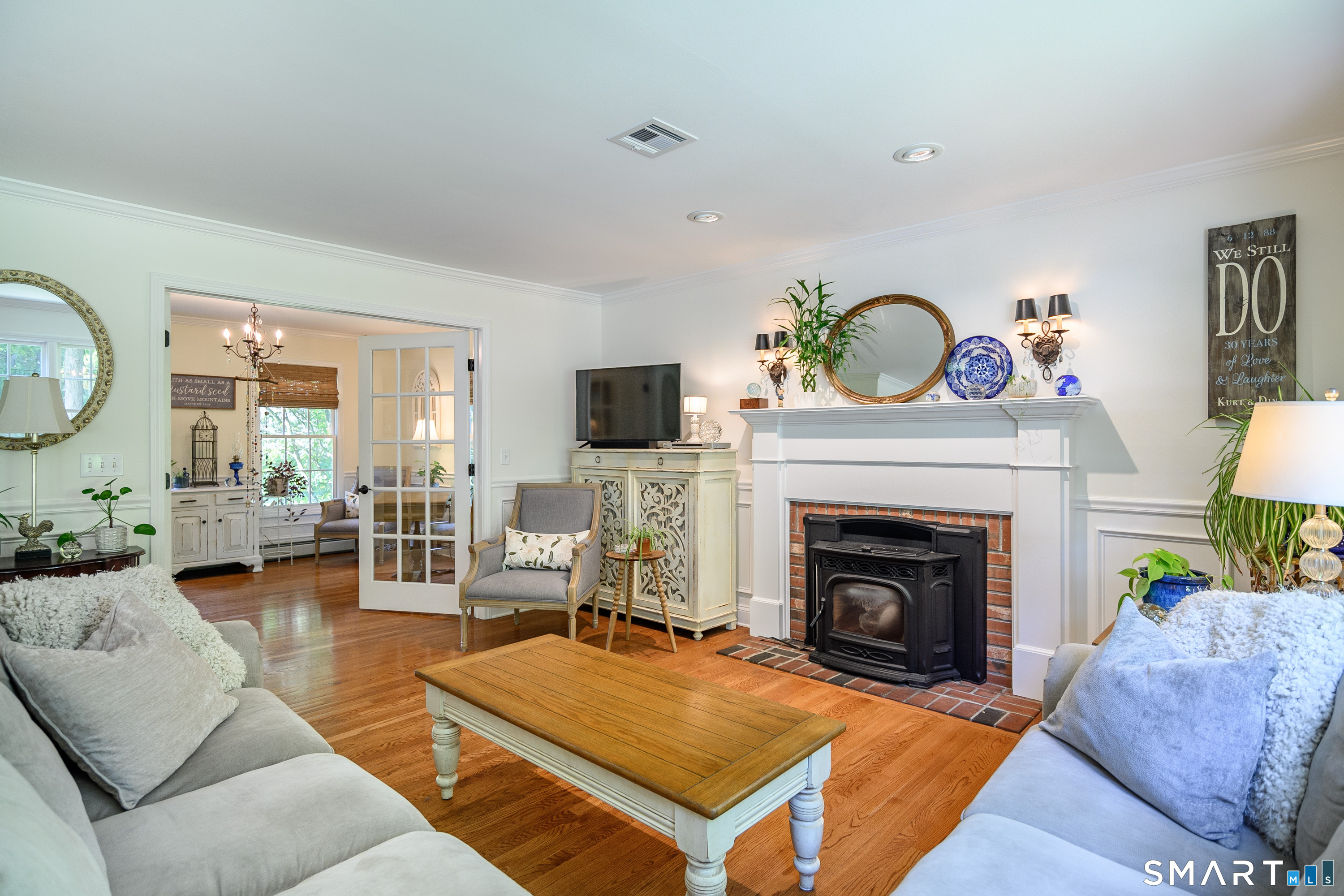 21 Phyllis Lane Newtown, CT 06470 - Photo 8 of 40 Comfortable family room with fireplace and wood stove insert for added warmth and charm.