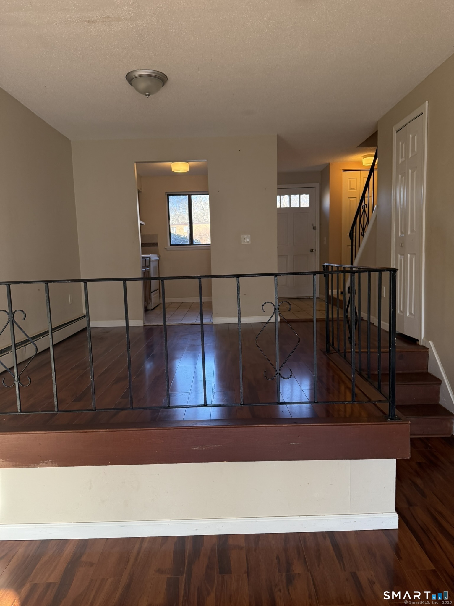 11 King Arthur Drive, Unit 2H East Lyme, CT 06357 - Photo 6 of 10 a view of entryway and hall with wooden floor