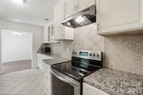 a kitchen with a stove and a microwave