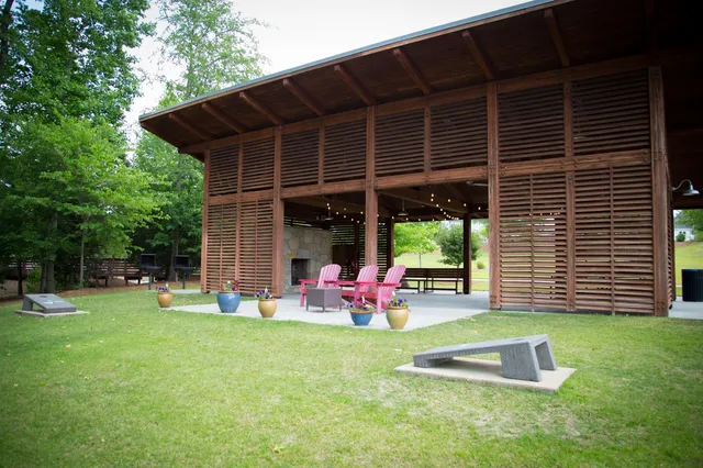 a front view of a house with a yard table and chairs