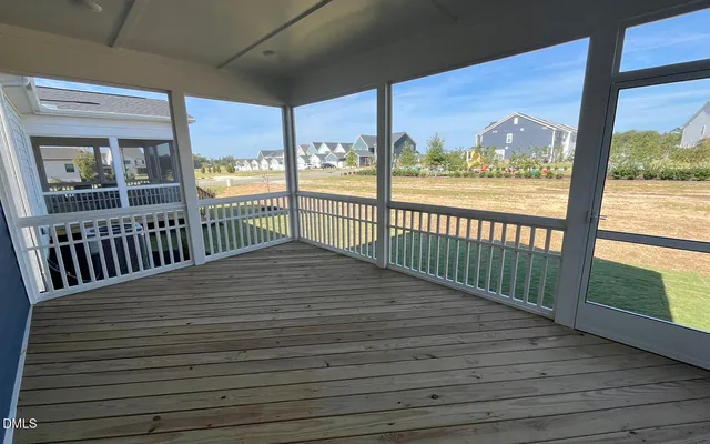 a view of a balcony with wooden floor