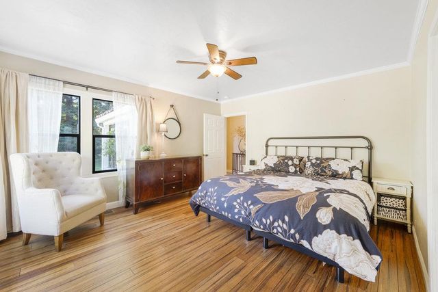 a bathroom with a sink a mirror and a window