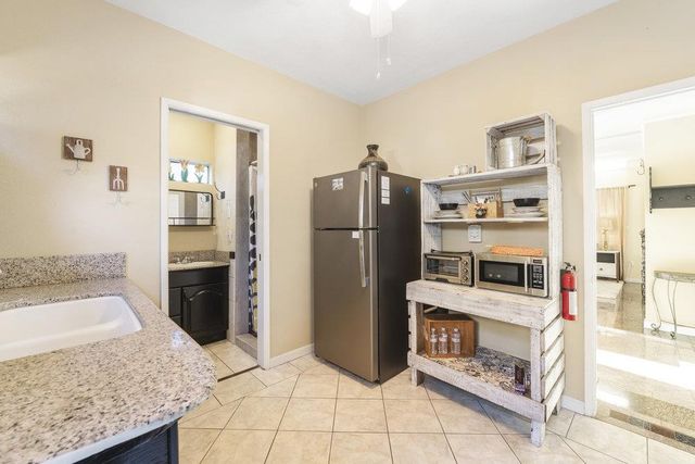 a living room with lots of furniture and a chandelier