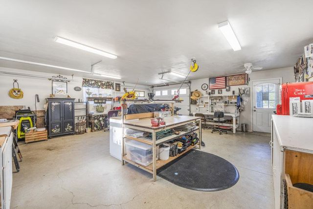 a view of a swimming pool with an outdoor seating