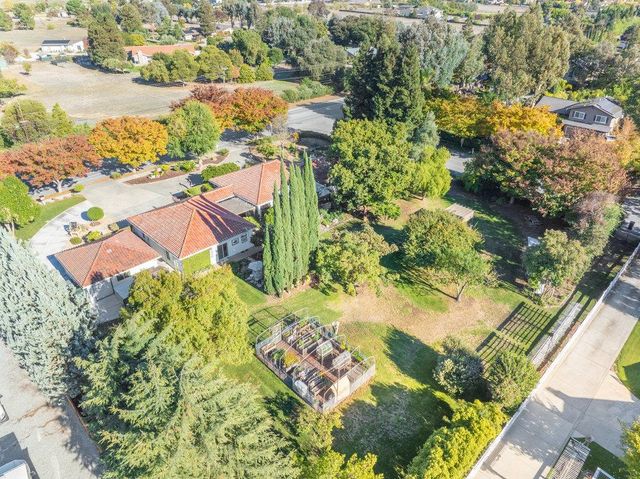 a swimming pool with outdoor seating and yard
