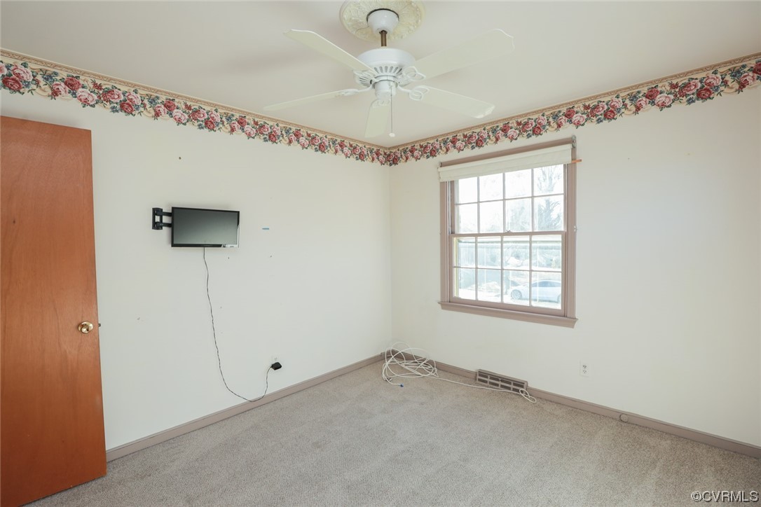 6424 Commander Road Richmond, VA 23224 - Photo 11 of 46 a view of a livingroom with a window and a ceiling fan
