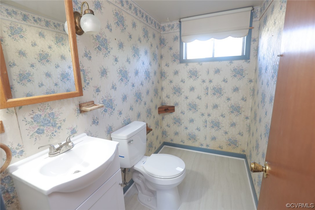 6424 Commander Road Richmond, VA 23224 - Photo 35 of 46 a bathroom with a sink a toilet and shower