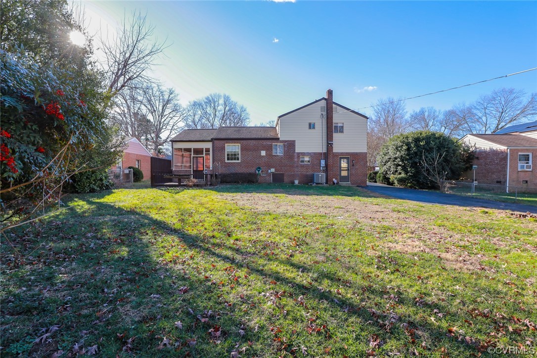 6424 Commander Road Richmond, VA 23224 - Photo 43 of 46 a view of a house with a big yard and large tree