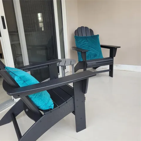 a living room with furniture and a mirror