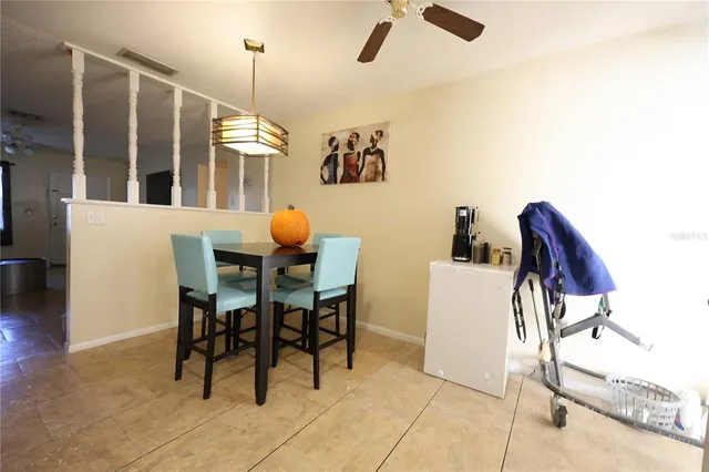 a dining room with furniture and window