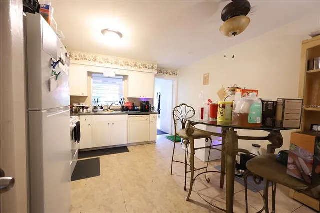 a kitchen with stainless steel appliances a refrigerator and a stove