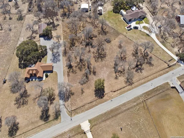 a aerial view of a house with a yard