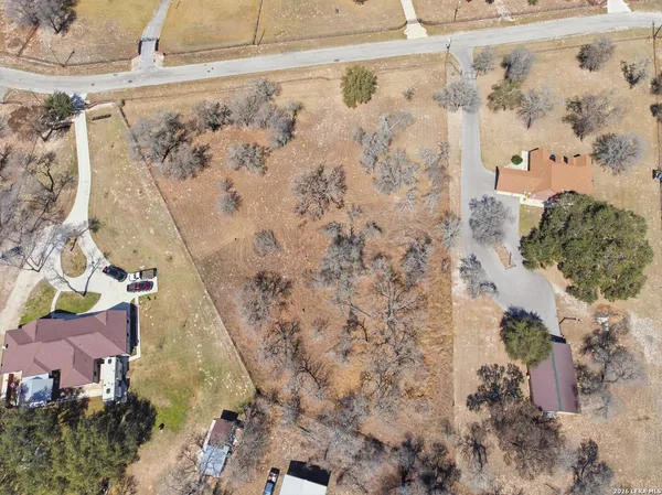a aerial view of a house with a yard