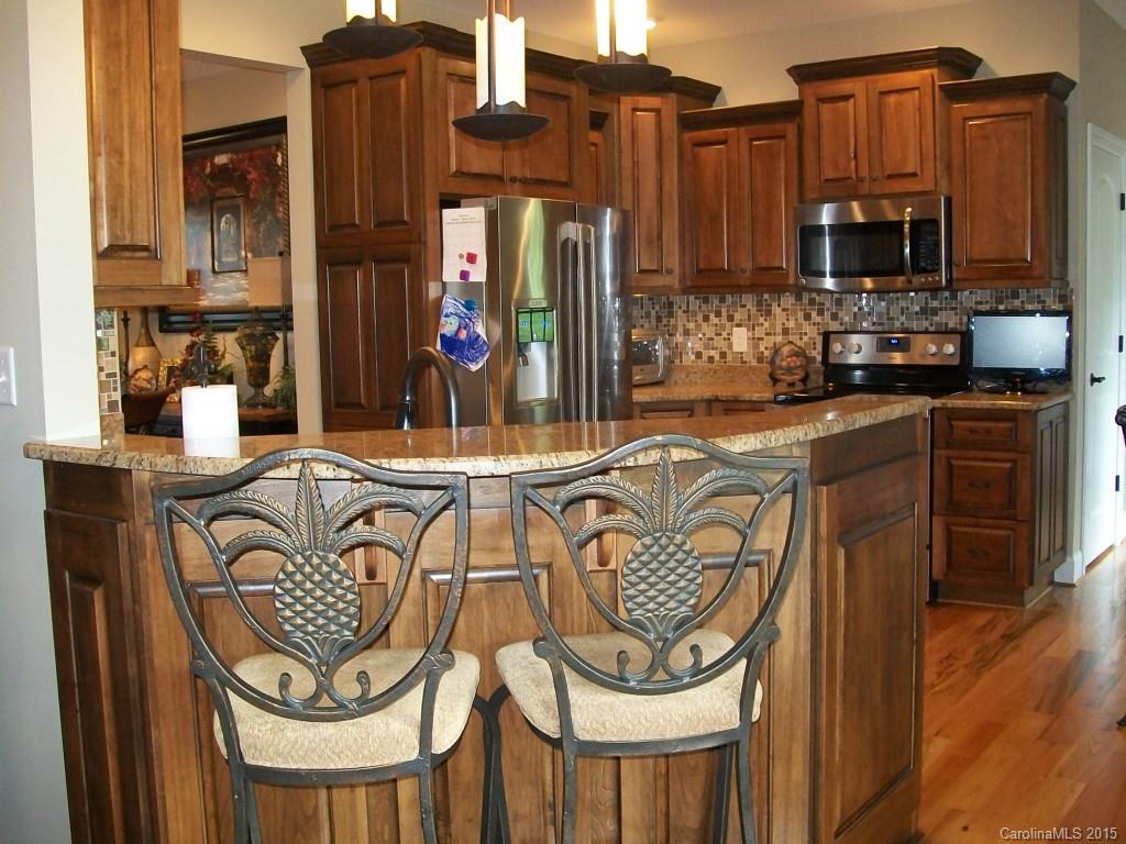 1707 Requa Road Cherryville, NC 28021 - Photo 11 of 24 a kitchen with stainless steel appliances granite countertop a sink and cabinets