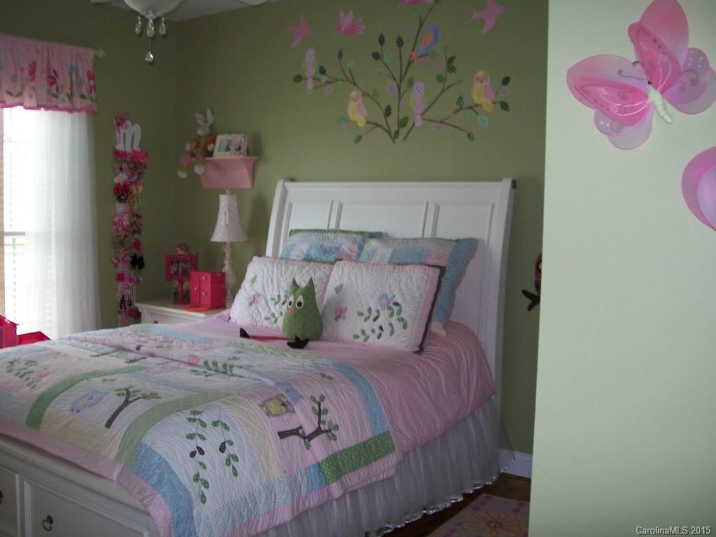 1707 Requa Road Cherryville, NC 28021 - Photo 15 of 24 a bedroom with a bed and a window with rug