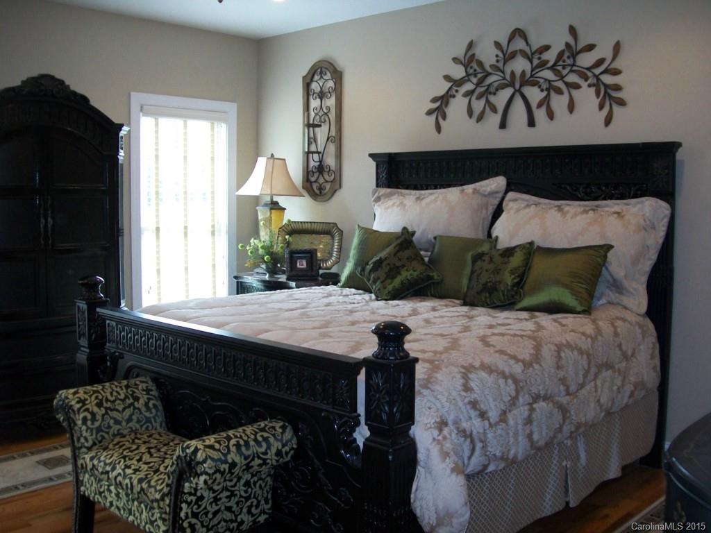 1707 Requa Road Cherryville, NC 28021 - Photo 17 of 24 a bedroom with a bed and wooden floor